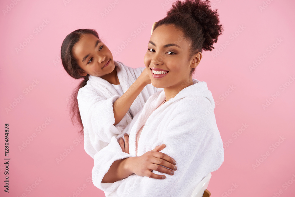 Little African American girl is combing mother Little African American girl is combing mother
