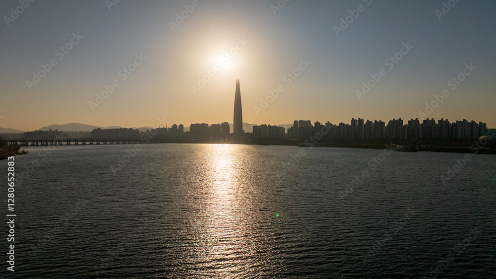 Naklejka premium Aerial view of Seoul, South Korea, with the Hangang River winding through the city, video by towering skyscrapers and historical landmarks