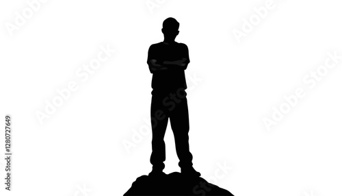 Silhouette of a man standing confidently on a rock