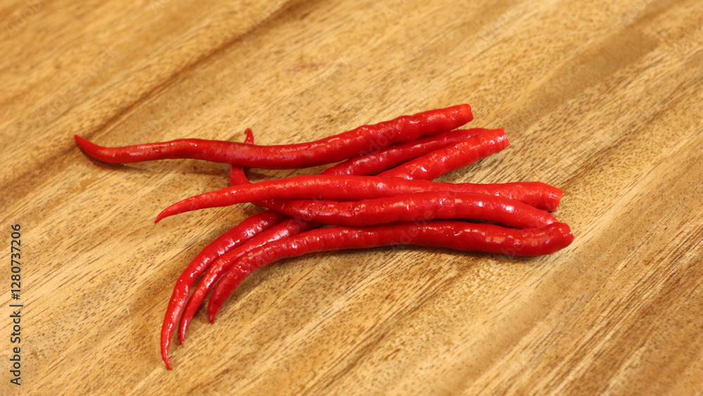 red hot chili peppers on wooden background red hot chili peppers on wooden background