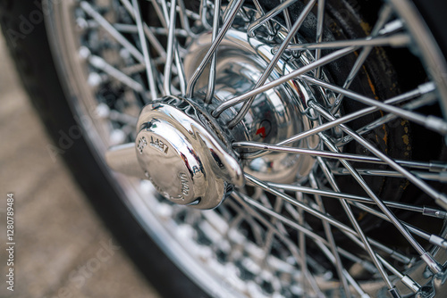 Close-Up of a Vintage Car's Chrome Wire Wheel Hubcap