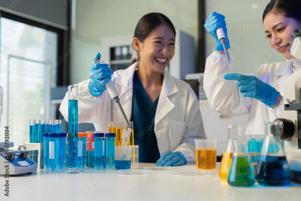 Scientist mixing chemical liquids in the chemistry lab. Researcher working in the chemical laboratory. Scientist mixing chemical liquids in the chemistry lab. Researcher working in the chemical laboratory.