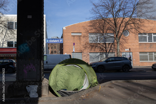 A homeless man's tent in Berlin Kreuzberg, under an elevated railway. A homeless man's tent, next to a steel beam photo