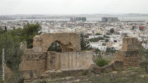 Ancient ruins of Carthage on Byrsa hill contrast with modern buildings and houses in Tunisia
 photo