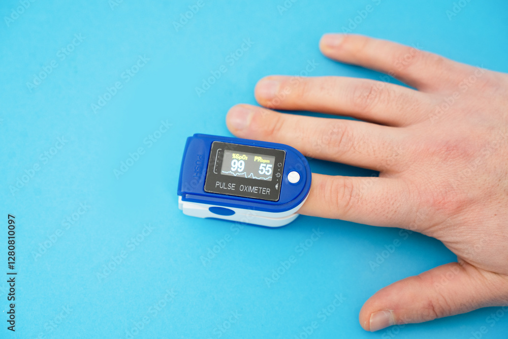 Pulse oximeter used to measure pulse rate and oxygen levels with hand. Pulse oximeter used to measure pulse rate and oxygen levels with hand.