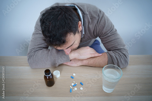 Tableau sur toile Man fighting stress with antidepressant drugs meds