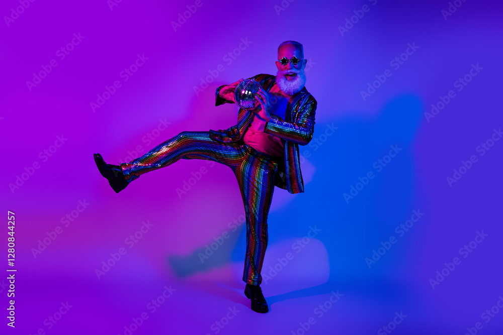 Obraz premium Full length photo of cool carefree mature guy dressed glamour costume star eyewear dancing disco emtpy space isolated neon purple color background