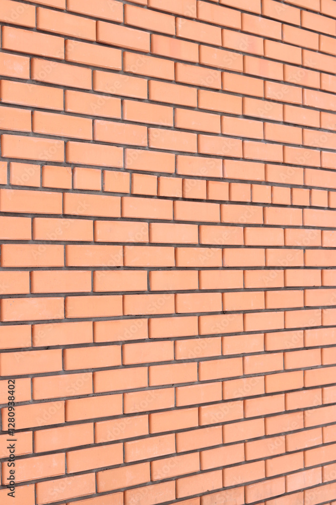 Obraz premium Brick wall side view background. Orange brick wall background for exterior design. Construction concept, outdoor buildings, garage or house. Wall with classic checkerboard pattern and visible joints
