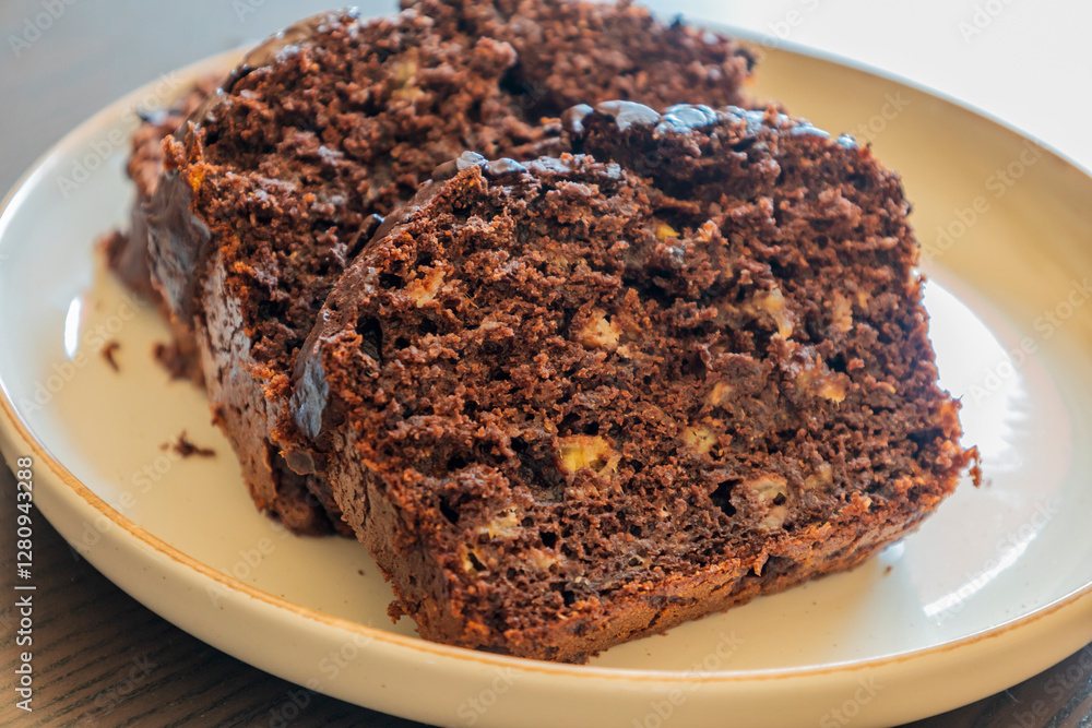 close-up of freshly sliced banana chocolate bread, showing its moist texture, rich chocolate swirls close-up of freshly sliced banana chocolate bread, showing its moist texture, rich chocolate swirls