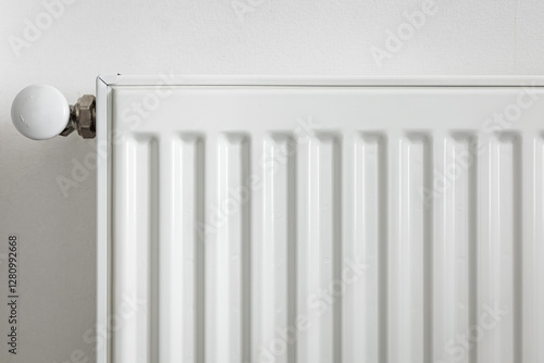 Wallpaper Mural Close-up of a white metal radiator with a temperature control valve. Modern home heating system, energy efficiency concept. Minimalistic interior with clean lines and functional design Torontodigital.ca