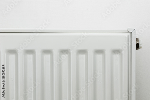 Wallpaper Mural Close-up of a white metal radiator with a temperature control valve. Modern home heating system, energy efficiency concept. Minimalistic interior with clean lines and functional design Torontodigital.ca