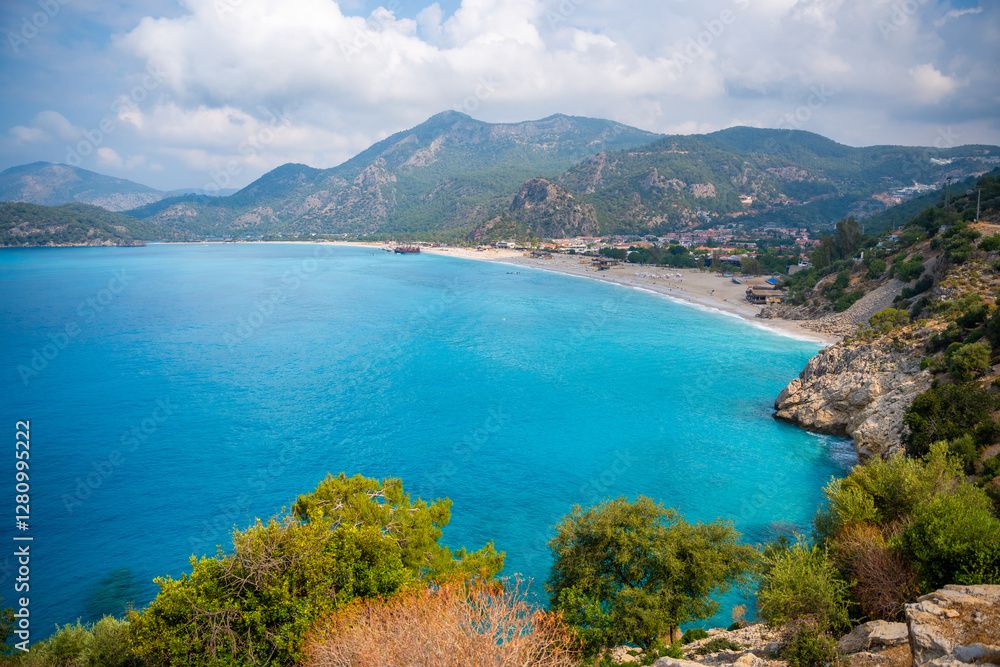 Aerial view of Oludeniz beach with people and boats in the morning, Coastline next to Fethiye, Turkey Aerial view of Oludeniz beach with people and boats in the morning, Coastline next to Fethiye, Turkey