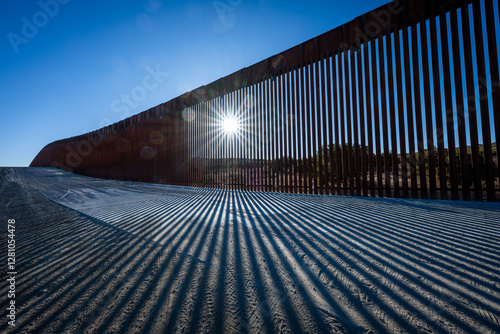 border wall fading into horizon