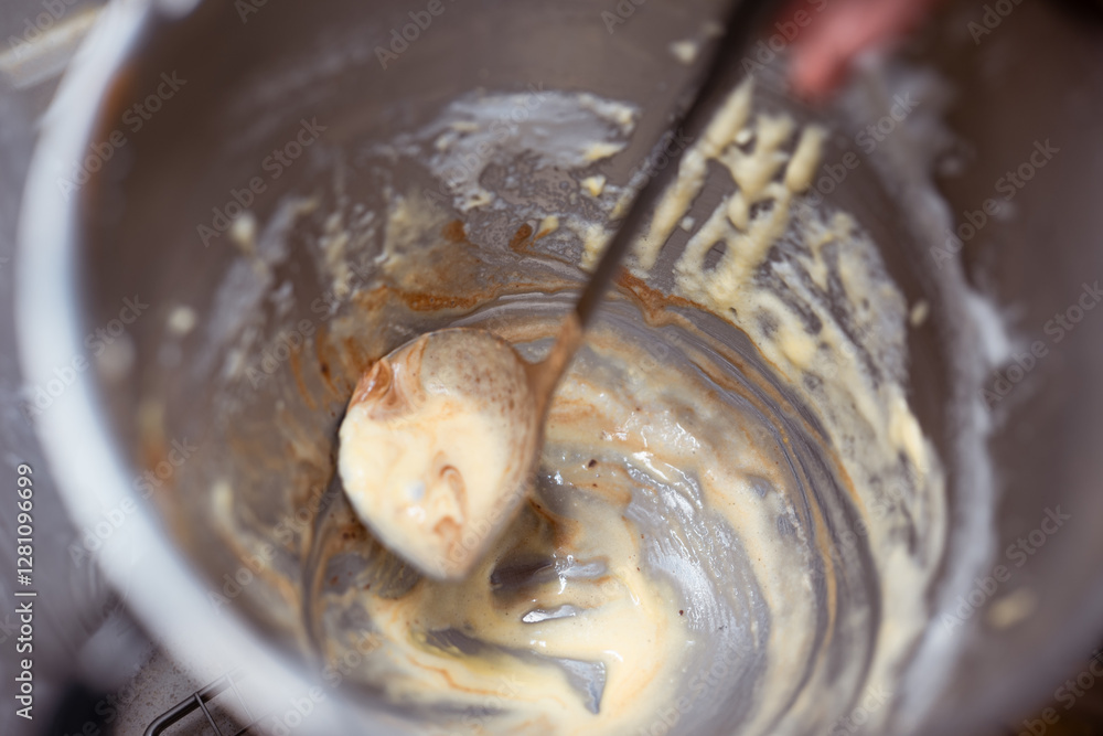Fototapeta premium Home Low Sugar Party Baking Mixture in a mixing bowl,rustic and messy home kitchen