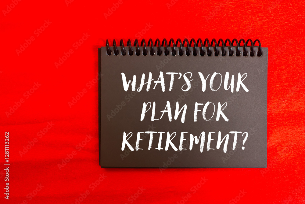 What’s your plan for retirement message written on black notebook page on red background. Conceptual what’s your plan for retirement symbol. Copy space. What’s your plan for retirement message written on black notebook page on red background. Conceptual what’s your plan for retirement symbol. Copy space.