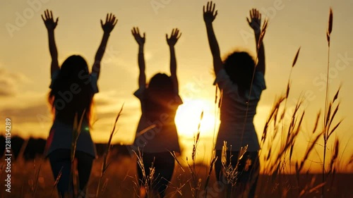 Happy kids frolic in a sunlit field during a golden summer evening.