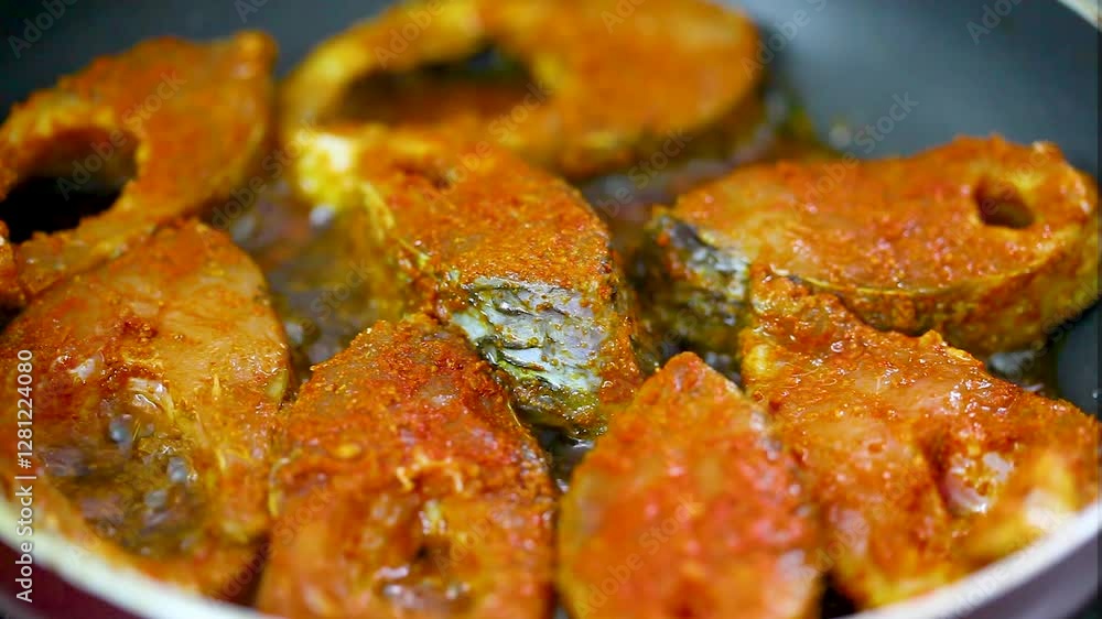 Fish fillets are fried in a pan. Fish fillets are fried in a pan.