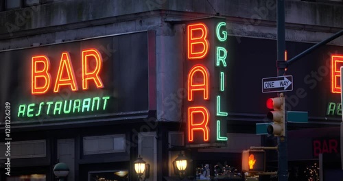A nighttime exterior establishing shot of an unbranded bar and restaurant in downtown Manhattan, New York City. Day/Night matching available.  	