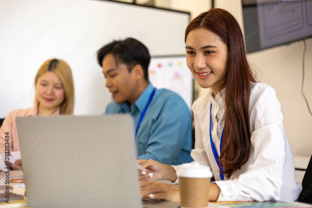 Three people are sitting around a table, working on a project. They are wearing name tags and are pointing at a whiteboard. Scene is collaborative and focused
Three people are sitting around a table, working on a project. They are wearing name tags and are pointing at a whiteboard. Scene is collaborative and focused