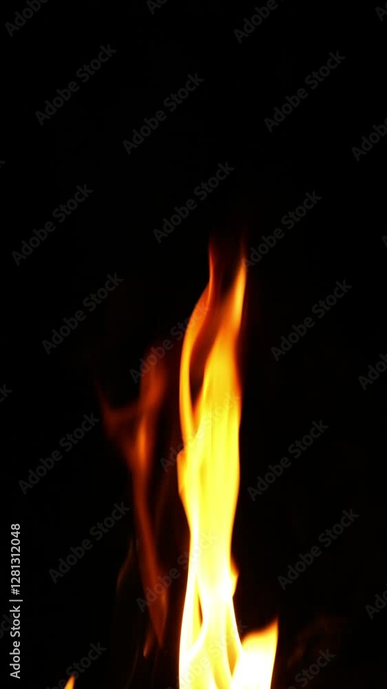 closeup of a single high flame with smoke texture isolated on black background, slow motion design element template overlay decoration closeup of a single high flame with smoke texture isolated on black background, slow motion design element template overlay decoration