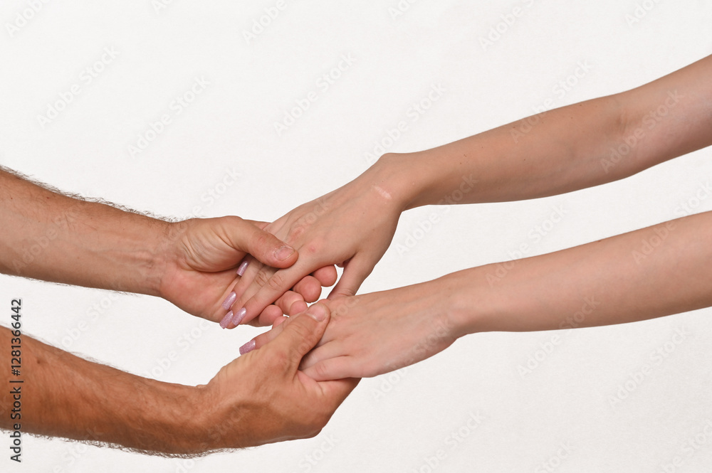 male and female hands gently hold each other. on a white background. close-up male and female hands gently hold each other. on a white background. close-up