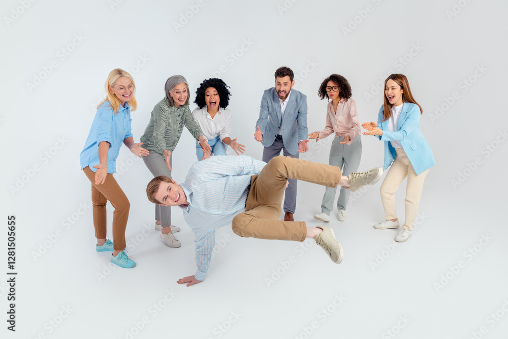 Group of diverse colleagues sharing a lively moment of playfulness and teamwork in an office environment Group of diverse colleagues sharing a lively moment of playfulness and teamwork in an office environment