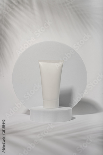white cosmetic packaging with palm leaf 