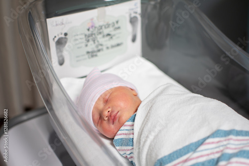 Just born swaddled newborn baby at the hospital. Baby's birth day