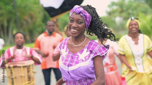Portrait of a beautiful girl from the Garifuna ethnic group wearing a beautiful traditional costume in lilac color.