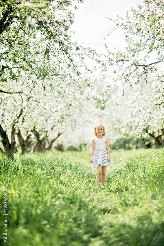 girl sniffing flowers of apple orchard. garden with flowering trees. Allergy season. Soft focus. Girl enjoying floral aroma. Child enjoy life without allergy. girl sniffing flowers of apple orchard. garden with flowering trees. Allergy season. Soft focus. Girl enjoying floral aroma. Child enjoy life without allergy.
