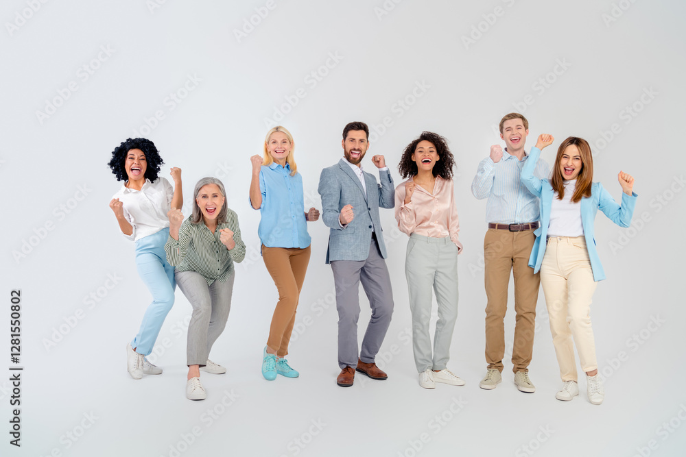 Fototapeta premium Diverse group of cheerful business professionals celebrating teamwork on a light background