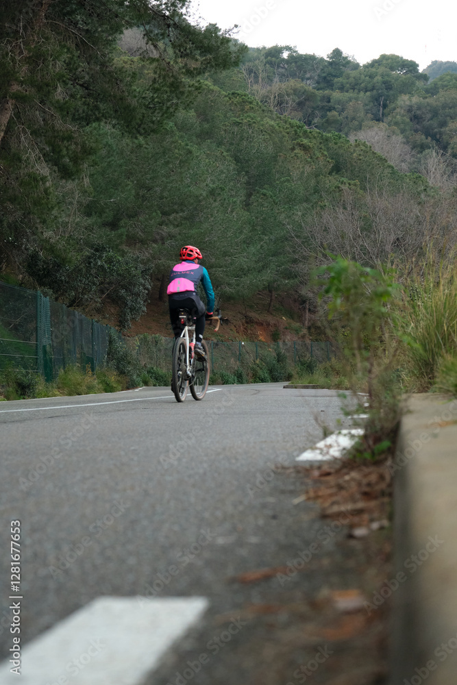 Cyclist on the roadway outside the city Cyclist on the roadway outside the city