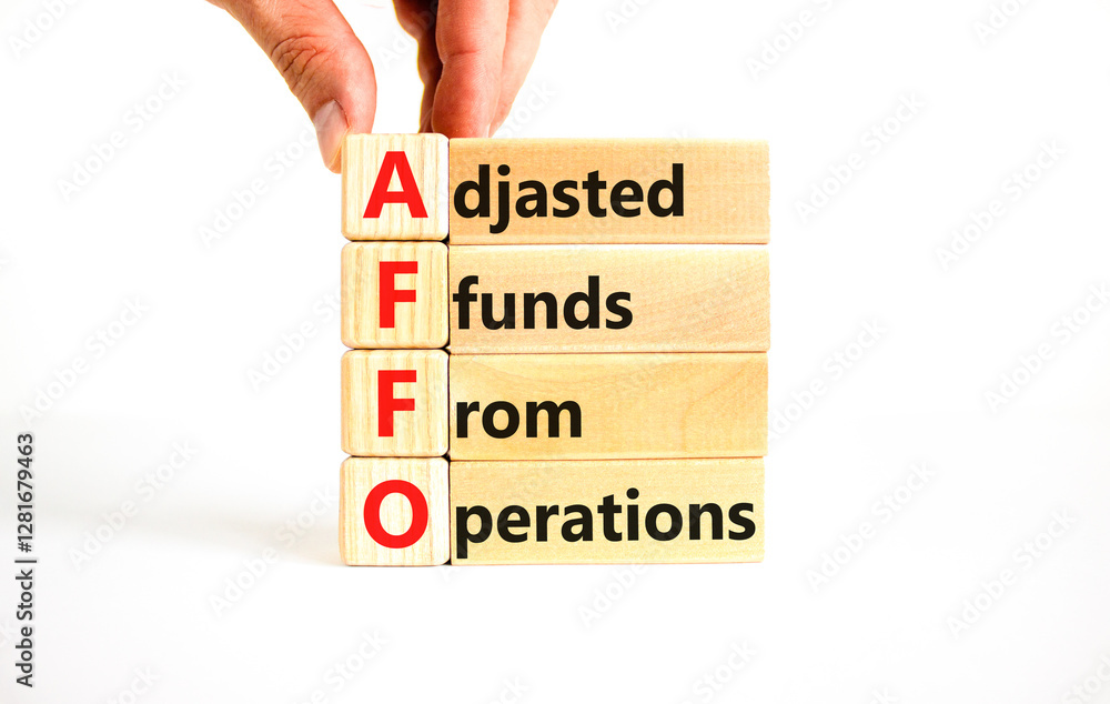 AFFO symbol. Concept word AFFO Adjusted Funds From Operations on beautiful wooden blocks. Beautiful white background. Business AFFO Adjusted Funds From Operations concept. Copy space. AFFO symbol. Concept word AFFO Adjusted Funds From Operations on beautiful wooden blocks. Beautiful white background. Business AFFO Adjusted Funds From Operations concept. Copy space.