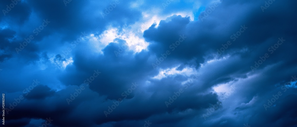 Dark, swirling storm clouds with a hint of light create a dramatic and atmospheric view of nature’s power and unpredictability in the sky. Dark, swirling storm clouds with a hint of light create a dramatic and atmospheric view of nature’s power and unpredictability in the sky.