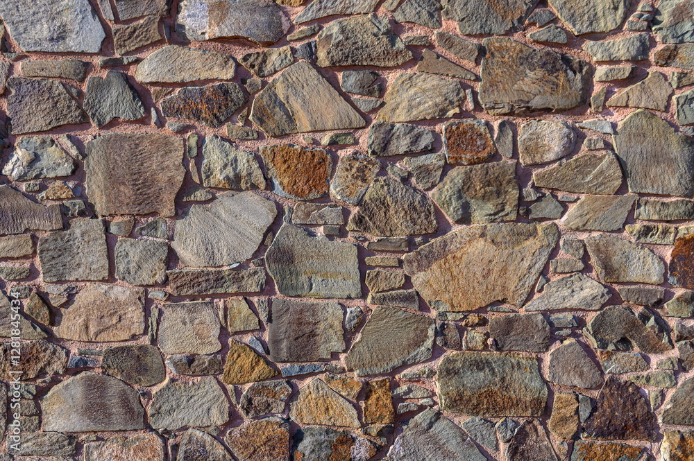 Beautifully textured stone wall showcasing nature's artistry in a serene outdoor setting