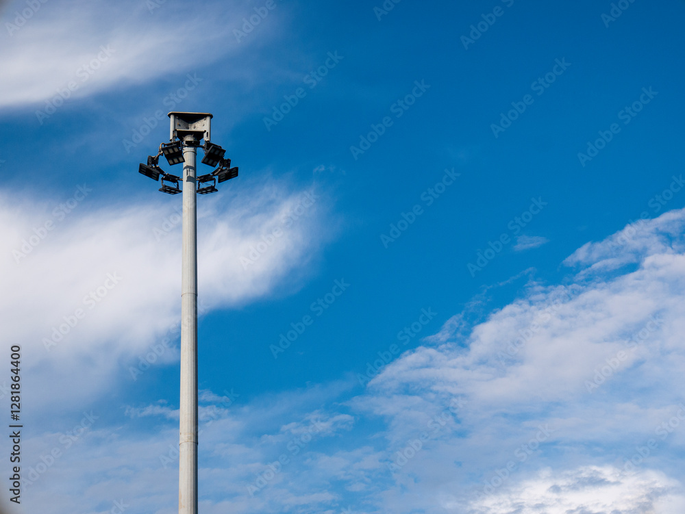 Public street light pole with LED lights and stunning cloudy blue sky background. Street lights function for street lighting and public security. Public street light pole with LED lights and stunning cloudy blue sky background. Street lights function for street lighting and public security.