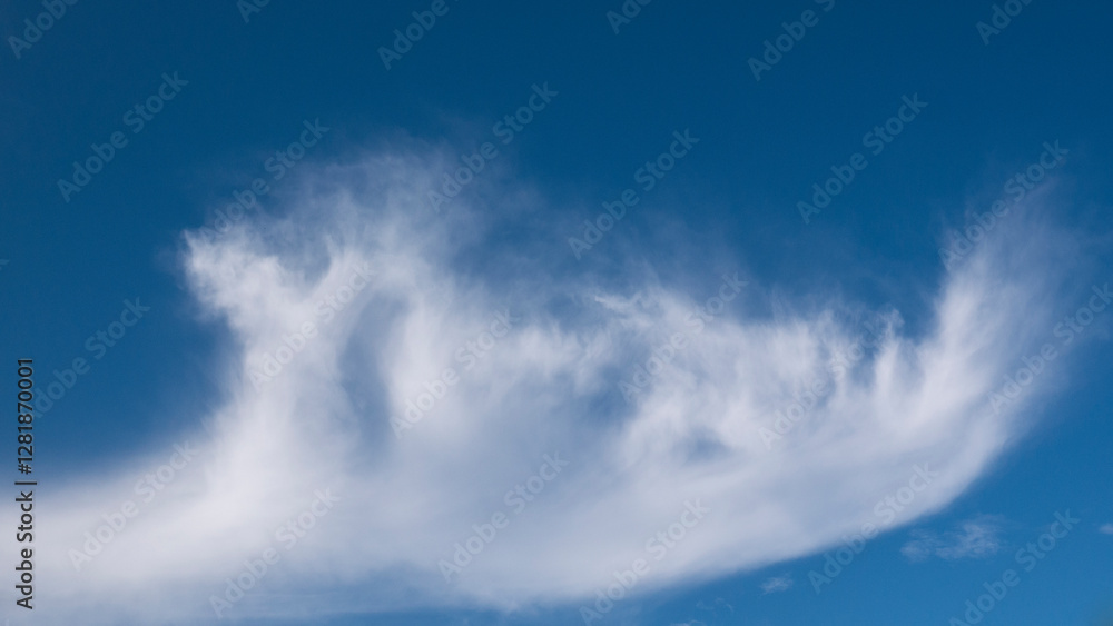 The beautiful and amazing view of clouds with abstract shape, looks pure white when illuminated by the morning sunlight and the beautiful bright blue sky creates a contrast between clouds and sky.