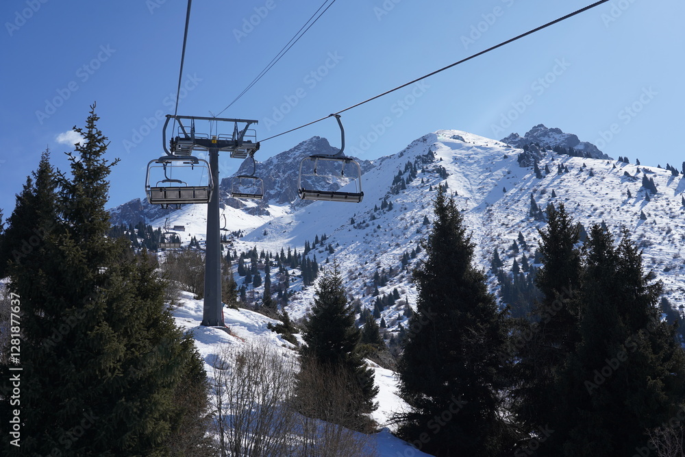 A cable car in a mountainous area. Winter. Shymbulak A cable car in a mountainous area. Winter. Shymbulak