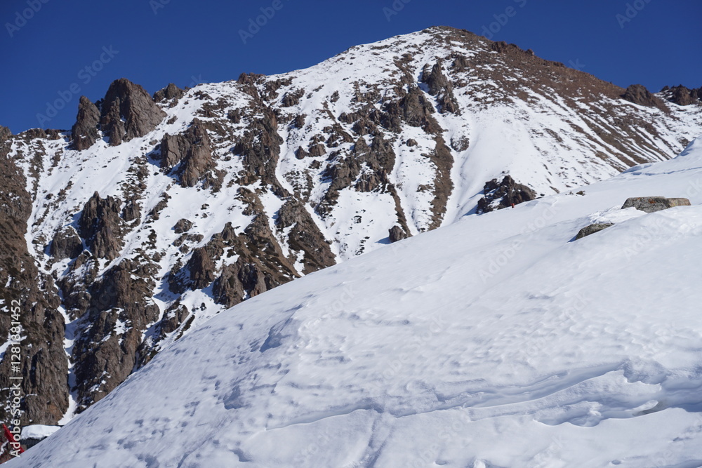 Mountainous area with different trees and fir trees. Winter. Ski resort. Mountainous area with different trees and fir trees. Winter. Ski resort.