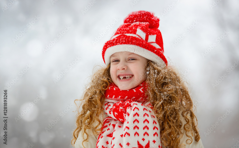 Portrait of smiling toothless girl in winter park. Happy childhood concept. Portrait of smiling toothless girl in winter park. Happy childhood concept.