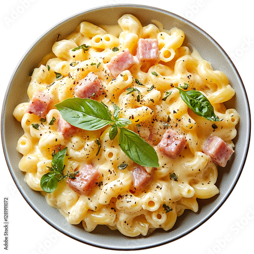 A bowl of creamy macaroni and cheese with ham cubes and basil leaves. photo