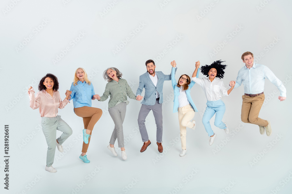 Naklejka premium Diverse group of professionals jumping together in enthusiasm against light background, multi-age
