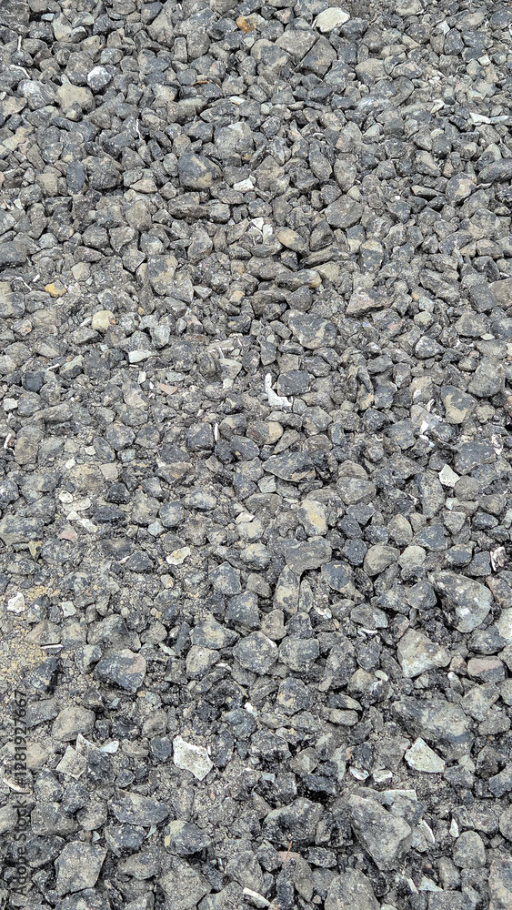 Close-up of crushed asphalt and gravel used as a base layer for road construction. This material improves stability, drainage, and durability, ensuring a solid foundation for paving and resurfacing. Close-up of crushed asphalt and gravel used as a base layer for road construction. This material improves stability, drainage, and durability, ensuring a solid foundation for paving and resurfacing.