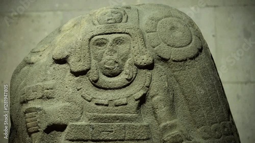 Ancient Olmec petroglyphs carved into stone, showcasing intricate symbols and sacred imagery from Mesoamerican civilization.