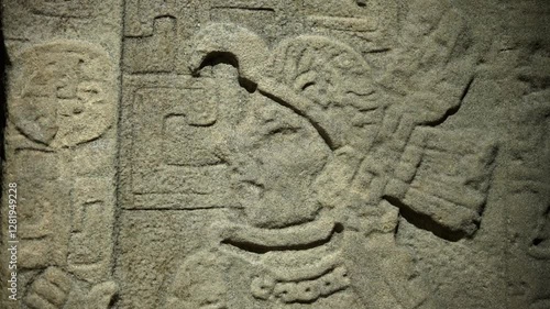 Ancient Olmec petroglyphs carved into stone, showcasing intricate symbols and sacred imagery from Mesoamerican civilization.