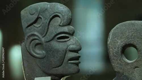 Olmec stone sculpture, depicting intricate symbols and sacred images of the Mesoamerican civilization.