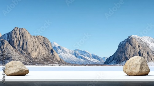 Serene Winter Landscape with Rocks and Snowy Mountains in Background