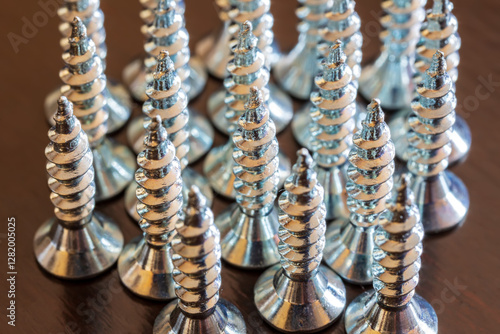 Close up of screws on a table. Advertising photo
