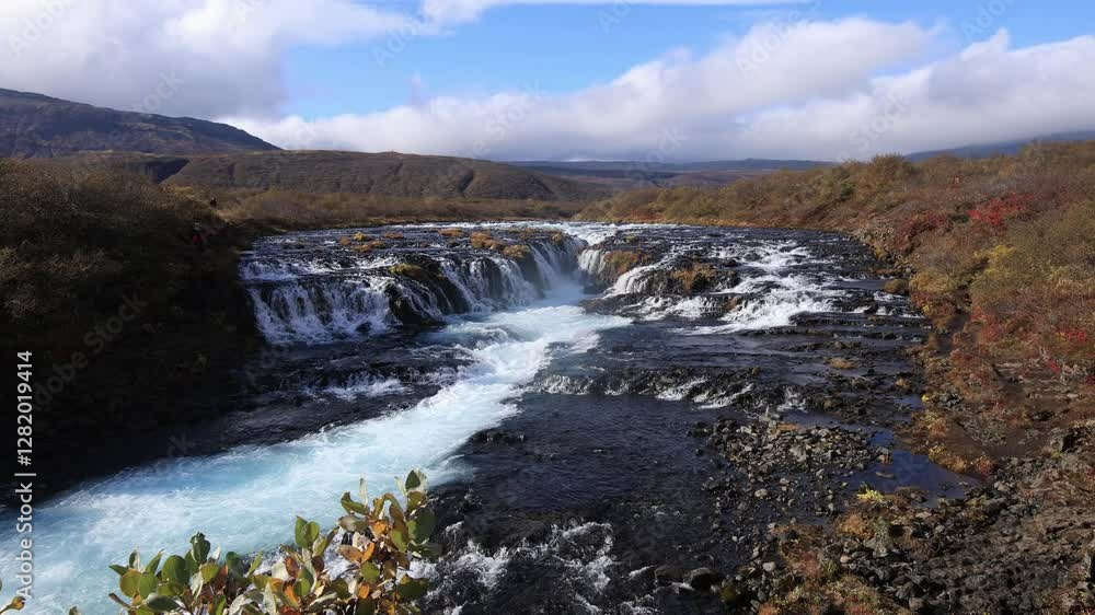 Cascading waterfall Bruarfoss in the south of Iceland with crystal-clear water and sunny weather Cascading waterfall Bruarfoss in the south of Iceland with crystal-clear water and sunny weather