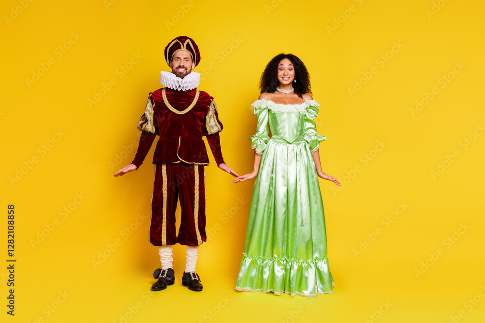 Romantic Couple in Elegant Period Costumes on a Bright Yellow Background for a Themed Carnival Romantic Couple in Elegant Period Costumes on a Bright Yellow Background for a Themed Carnival